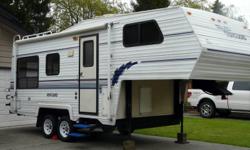 23' 5th wheel, 1/2 ton towable, less than 5,000 lbs dry weight, no slides but roomy. Excellent condition, sleeps 6, 3 burner stove with oven, 2 sided sink, lots of storage, queen size pillow top mattress, all four tires have less than 2 seasons, sound