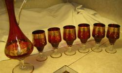 THESE are very ELEGANT!!GREAT CHRISTMAS GIFTS or GREAT for ENTERTAINING!! I have 2 ITALIAN DECANTER & 6 GOBLET SETS-LIKE NEW - $120.00  per set..One is red with GOLD PLATE.The other is blue with GOLD PLATE. They have NO chips or scratches and are in