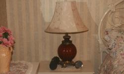 2 bedroom or living room lamps with amber glass bases and cream coloured lamp shades each $30.00 Excellent condition