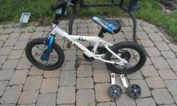 Star Wars two wheeler bike with training wheels. Excellent for boys and girls. 16 inches high. Seat can be adjusted.