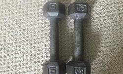 2 barely used 10 pound weights and 2 well used 5 lb weights. $15 for both or $10 each separately