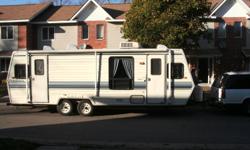 I have a 92 Dutchmen trailer 32',full bathroom with toilet, bathtub/shower, full sink with vanity, dual propane electric fridge full size, full propane stove, built in microwave, full size couch that turn into bed, master bedroom in back with private