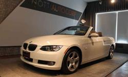 2009 BMW 328i Convertible!! This beautiful alpine white 328i convertible has a sleek retractable hardtop that looks seamless put up, and once retracted, shows off the luxurious tan leather seats with wood grain trim. The 328i is fitted with BMW's world