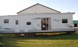2011 *new* 39ft. Hy-Line RV - (model# 39 CR2PA). Has 3 slide outs, 8ft ceiling, full bathroom etc.
This unit has never been used. Currently located 10 mins. north of Woodstock. This trailer lists @ $40,000.00+. See dealer site for more info -