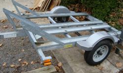 This is a 3 bike trailer that is best for dirt bikes or small road bikes. The trailer can carrie 725 kg and is light weight, less than 200 lbs and has a 1 7/8 coupler. It's galvanized [wont rust] Has greas nipples on the hubs and a new spare. I dont ride