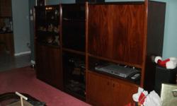 3 piece lighted solid wood entertainment unit.  Smoked glass doors with brass accent hinges.  Like new