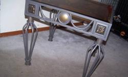 Hello, We are selling these beautiful living room table set for $65.00 or best offer. One longer coffee table and matching end tables. I am not exactly certain on what they are made of but it looks like metal with a glass topping. Pictures will give you a