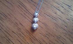 Elegant 3 stone Diamond necklace in great condition! 10 kt White gold chain and pendant. Originally purchased for $600. Asking $200. Call Wayne at 250-819-6442 if interested.
