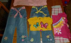 Lot of 7 items for sale. 2 pairs of girls jeans, one pair with yellow tie belt and one pair with pink tie belt. 1 yellow butterfly t-shirt. 1 pink pair of stretchy pants with matching pink t-shirt. 1 pair of pink plaid pants with Foofa (Yo Gabba Gabba)