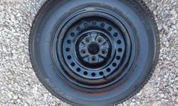 4 all season tires on rims. P195/70R14.Rims 5 bolt. Good shape. Please call 393-7889.