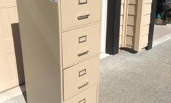 Free 4 drawer Commodore filing cabinet, almond colour. Damaged lock but otherwise works great. First come, first served. Come and get it.