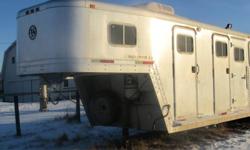 28 foot horse trailer - 4 horse slant - all aluminum.  Has mid-tack and living quarters - 4 foot short wall.  LQ has a/c, fridge, microwave, separate toilet and shower.  Horse trailer has drop down windows, rubber matting up inside, escape door - very