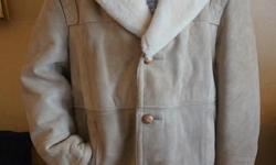 If the item is listed it is still for sale. It is removed immediately when sold. This mens coat looks new never worn and is in mint condition. It is lambskin with a shearling sheared collar. Not sure of the size but is 21 inches from shoulder to shoulder