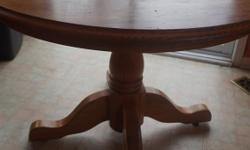 If the item is listed it is still for sale. It is removed immediately when sold. This is a solid oak pedestal round table table with two extensions, Included are 4 matching chairs. It is in good condition with a few water marks on the surface Also a