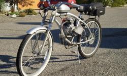 49cc 4-stroke motorized bicycle...Cost over $700.00 in various parts and materials (machining,bike etc...) ,120 mpg,25-30 mph,comes with brand new never used 49cc spare engine.This thing is a hoot and quite the conversation peice.perfect for puttin'