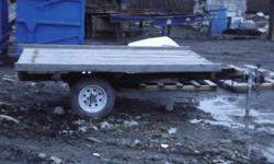 5by8 flat deck trailor,2by6 decking,new axle and springs,new tires and rims,1&7/8 ball,tows good,selling b/c building a new cargo trailor not needed anymore,would hold two ATV,built last year.