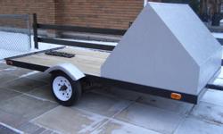 I have just built a new 5x10 single skidoo trailer built with 4x4 angle galenized steel and 2x2 tubing cross members all new pt bed ,12 inch wheels,led lights,fenders,wiring,chains coupler takes 2" ball has front fairing new tonge jack front fairing can