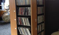 For Sale - 650 CDs in great shape. Variety of genres and styles from Blues to Pop to Rap / Hip-Hop to Classic Rock to Jazz to Rock and more. Mostly Rock / Classic Rock CDs.
$1.53 per CD & the rotating CD Rack pictured included - holds approximately 650