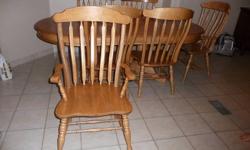 Solid wood
table-64" length (plus an 18" removable leaf ) 42" wide
2 arm chairs, 4 regular chairs