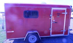 6x12 Red Haulin Trailer/ Camper
Great shape with rear ramp door, 1 Side window, Detachable screen side door, Detachable rear screen door, Front counter top and sink with 12V RV pump, Under and overhead cupboards, Side wall shelving with storage bins, Two