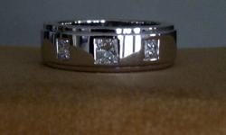 Beautiful Men?s Diamond Ring.  Professionally cleaned and appraised at $4,840.00 January 9, 2012.  Is in new condition.  This ring weighs 18.70 grams and is presently a size 10.5.  It can be resized by the buyer.  The total diamond weight is .78 Ct.  The