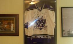 '98 - '99  LOS ANGELES KINGS AUTHENTIC PROFESSIONAL HOCKEY JERSEY (HAS FIGHT STRAP). SIGNED BY ALL THE TEAM PLAYERS SUCH AS LUC ROBITAILLE, ROB BLAKE, JOZEF STUMPEL, RAY FERRARO, YANIC PERREAULT, STEVE DUCHESNE, RUSS COURTNALL, MANNY LEGACE, JAMIE STORR