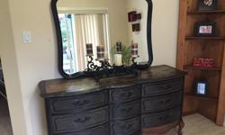9 Drawer French Provincial dresser made by AP Industries
Espresso stain covering drawers giving it that rustic feel.... have painted the frame, drawer handles, top as well as the mirror in a satin black giving it that classy 2 tone look
It has all been
