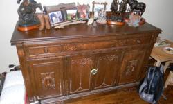 9 Piece Antique Dining room suite!
6 chairs, one of them a captain's chair.
Table with 2 leaves that pull out to extend the table.
Hutch/China cabinet
Buffet.
We bought this set with the intent of stripping and re-furbishing everything for our own use.
We