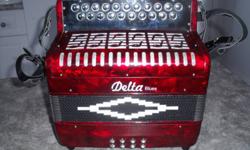Delta Blues button accordion - G & C - 21 button keys & 8 bass button keys.  New and it comes with a hard-shell case.