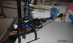 selling a trex 450   lots of aluminum up grades has all servo plus gyro and  esc  and brushless motor installed  and has spectrum  receiver in it its 2.4 ghz so any spectrum  remote will work as long as  its for helis just bind and fly  nice heli  will