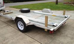 Aluminum flatdeck utility/car trailer, light, strong, no rust. 6X12 deck, 3,500lb axle, very low miles, needs nothing but a new proud owner. Built on Vancouver Island by Express Custom Trailers in 2009. Perfect for snowmobiles, quads, motorcycles, side by