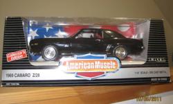 American Muscle 1969 Camaro Z-28 - 1/18 scale diecast metal collectible issued in 1995 by The Ertl Company, in excellent condition, first time out of the box was for this photo shoot.
 
-steerable wheels               
-opening doors and hood
-detailed