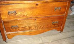 Solid Oak 2 Drawer Dresser.  Needs repair- see photos. 
44"long x 22" deep x 26" high
Antique- was brought from England by my grandparents when they immigrated!
$200or best offer
