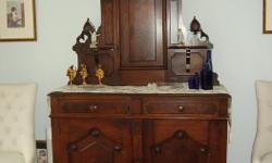 Antique buffet/sideboard; solid walnut; EastLake style; very good condition. Dimensions: 48 in wide, 36 in. tall (to serving level), 18 in. deep. (Back piece approx. 45 in. high).