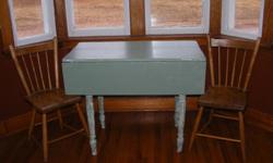 Antique table - with 2 drop leafs - has a few character cracks, but still a sturdy table comes with 2 antique chairs- painted a light green colour , legs left distressed look