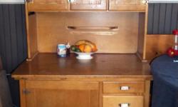 Antique hoosier, kitchen cabinet , solid eastern hardwood construction with all original hardware. Sturdy and in good condition for its age. Size: 40'BY 27" BY 64" HIGH.