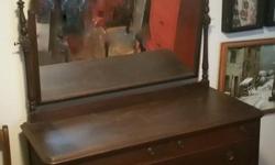I am selling a coveted Mahogany Dresser because of space issues.
It was made by Canada Furniture Manufacturers around 1911, I believe. It has the original brass drawer pulls, mirror, hardware and it's dovetail construction.
It measures 70" tall with the