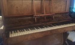 Beautiful Caleb Guest metal frame piano. Has been professionally tuned a number of times - not perfect, but good for its age with a couple of dead keys (says the piano tuner). The candelabra holes are present, but those pieces are gone. Music stand folds