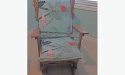 Antique rocking chair with new pillow coverings. Pick-up only.