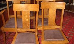 Set of Six matching Mission Oak dining Chairs that have a T back design,these quarter sawn oak chairs are very sturdy and well built chairs. Measure 39" Height total , Seat is 15.5" x 18" and 18" height to the floor.Cloth seats could be recovered if