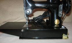 Antique Singer Feather Weight Sewing Machine Model No. 221-K Serial No. EM596491 made in 1957 in excellent condition. This machine weighs about 11 pounds and is  an ideal machine for quilters and other sewers to take to classses. Its very quiet and is