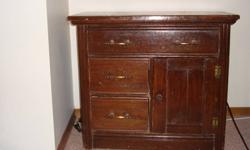 This is an antique wash stand made in the 1940's. It has been refinished, it is functional. $100.00 FIRM