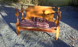 Antique Wood Bench
 
Antique Wood Bench constructed with the Head/Base boards of an antique bed.....the richness of the wood and detailing is beautiful. Comes with a striped cushion. The dimensions are: 22 inches deep x 38 inches high x 50 inches long