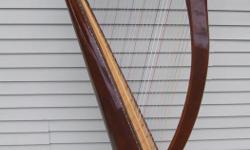 Aoyama 34-string Folk Harp with cloth cover, 2 sets of removable legs, tuning wrench
Model 130 B - Serial #610804 - Excellent condition
Full set of brass levers with blue and red markers
Round-back soundbox, spruce soundboard with lamination of maple and