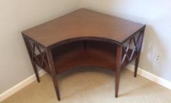Cool design dark wood four legs crisscross design on sides of corner table, curve cut out in front circa 1940's . All wood with a removable fitted glass to protect top surface. Great as a space saver for TV or can sub as a small desk. Dimensions are: 26"