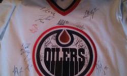 The Oilers jersey is a CCM men's medium. It has autographs from players from the mid/late 90's up until around 2002. Never worn just brought to the games to get signed so there are a few light scuffs. Other than that no damage. Please contact if