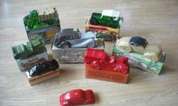 Collection of Avon decanters in excellent condition with boxes. 8 in all including Rolls Royce, '23 Maxwell, 80HP Big Mack Truck, '37 Cord, 1910 Fire Fighter, Army Jeep, 1968 Porche and VW Bug.