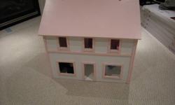 Wood babie house for sale.  Good Shape.  Pink and White in color.  Has a flip up roof for easy access.  Furniture not included.  Asking $100.00