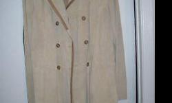 Banana Republic camel/sand colored suede coat with tan leather inserts. Size large. 39" long, 19" across chest. Never worn however there is a small defect in the leather that is not noticeable unless you're looking for it