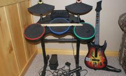 Complete Band Hero drum kit, with single Guitar and microphone, Available with Band hero CD and Guitar Hero III - Legends of Rock CD. Comes with original packaging. Fully assembled.